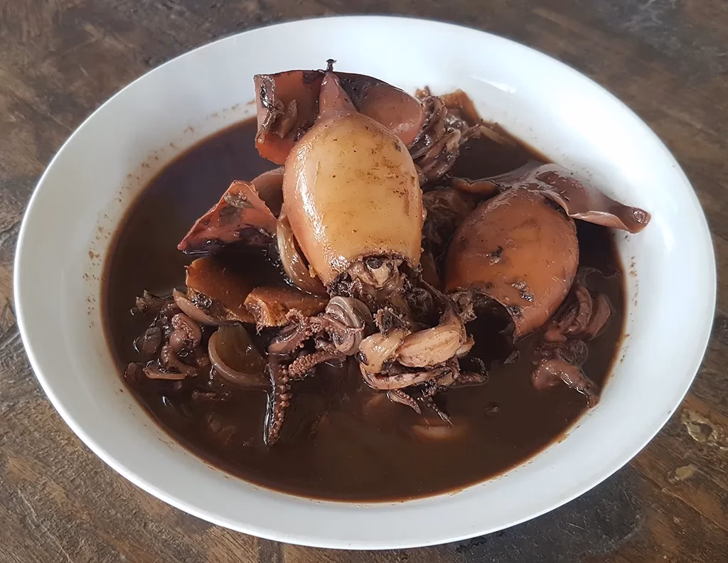 Adobong pusit (squid adobo) in the Squid's Black Ink.