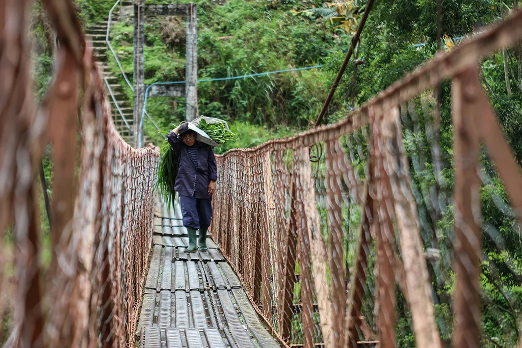 A farmer at work in the Banaue Rice Terraces! A very typical scene in this area. One of the best places to visit in the Philippines.