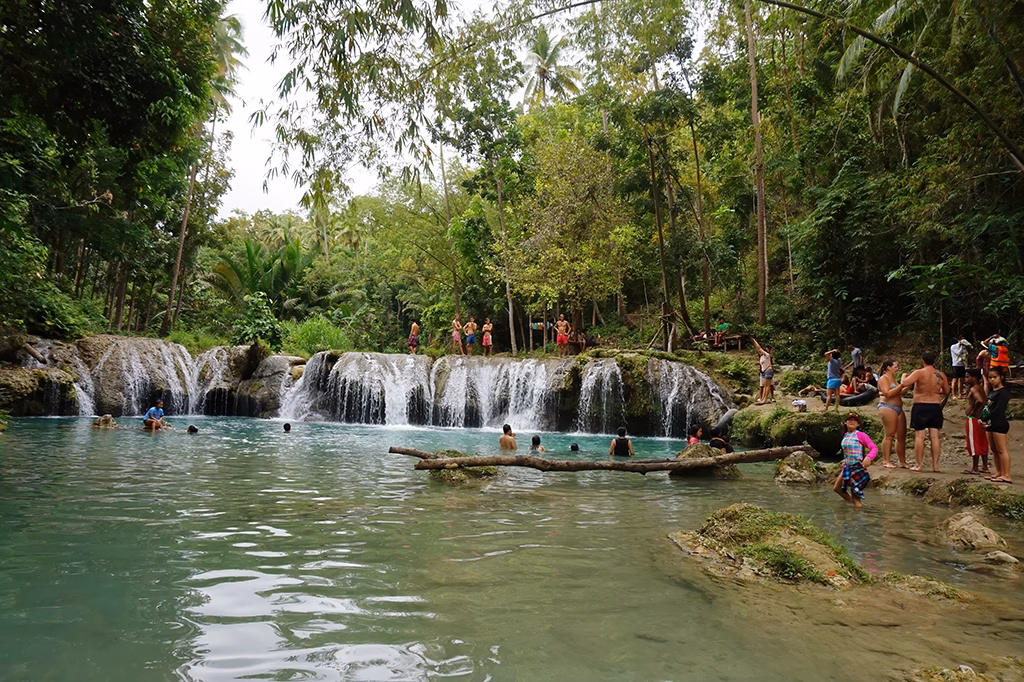 Scenic tiered Cambugahay Falls in Siquijor, with shallow pools perfect for a relaxing swim.