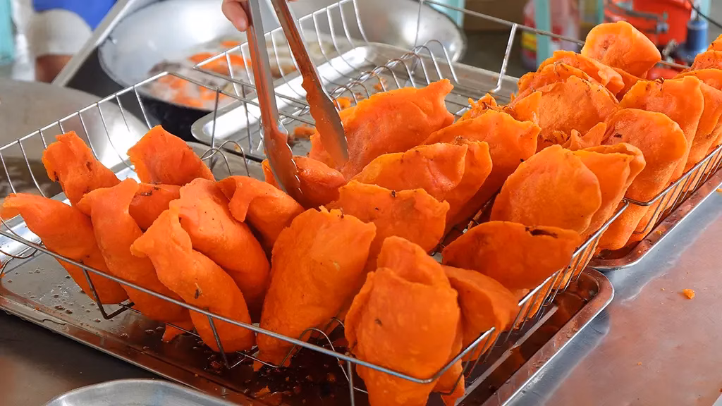 Here we have some Ilocos Empanada that is typically filled with grated green papaya, egg, and longganisa (local sausage). This is classic Filipino cuisine.