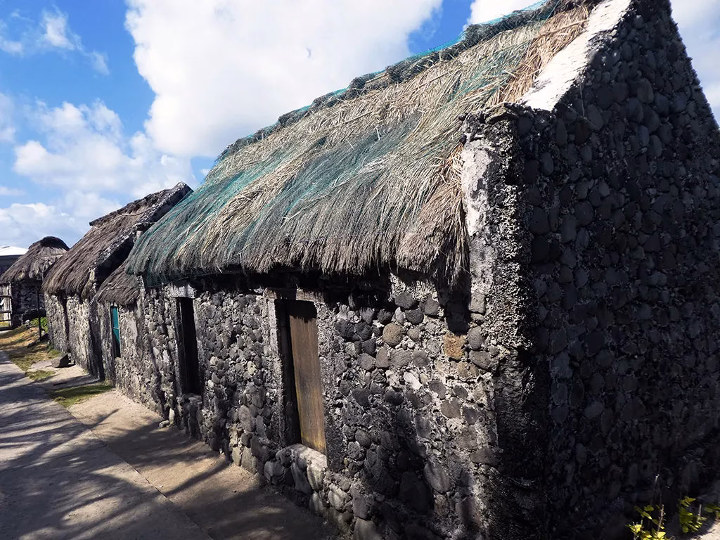 Traditional Ivatan stone houses with thatched roofs in Savidug village, Batanes.