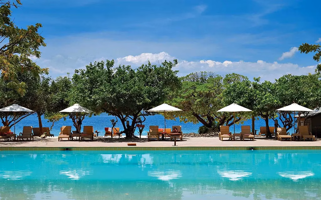 This is a picture of the poolside at a luxury resort in Palawan. You can see the ocean in the background!