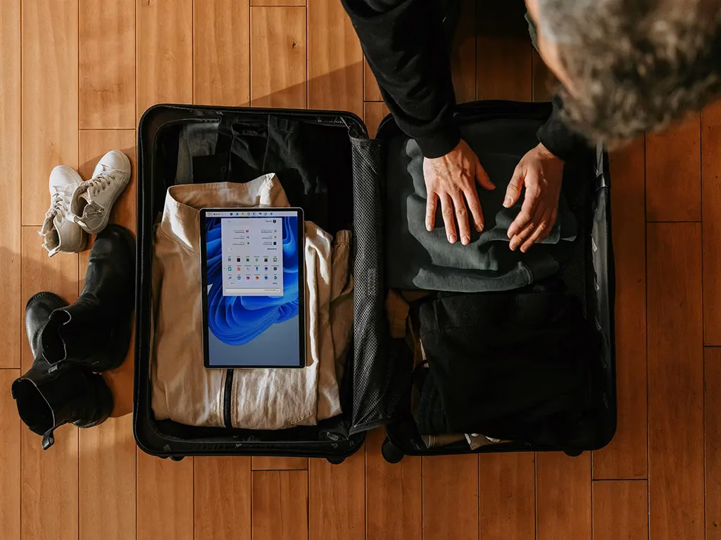 A neatly packed suitcase with comfy shoes, medications, and mosquito spray, ready for a senior-friendly trip.