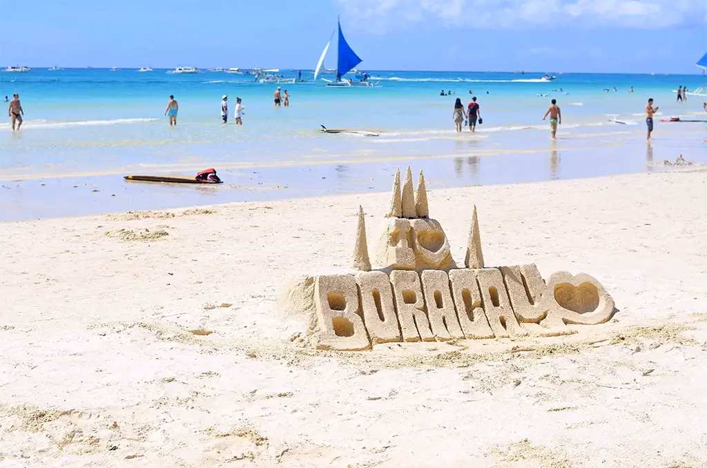 A picture of White Beach with a sand castle saying I [heart] Boracay!