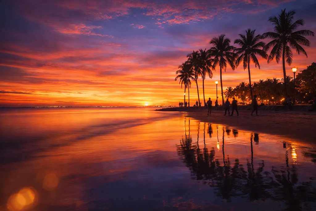 Manila Bay sunset long exposure photography with silhouettes orange pink sky Philippines