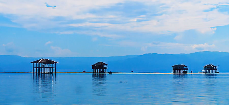 Manjuyod Sandbar white sand formation emerging from turquoise water at low tide Bais Bay Negros Oriental Philippines